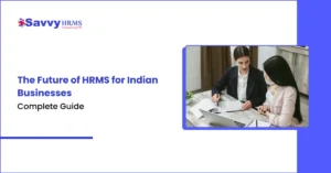 Two HR professionals collaborating on HRMS strategy using laptop and documents in contemporary office workspace.