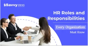 HR roles and responsibilities: professional team discussing HR roles in modern workplace with laptops and collaborative environment.